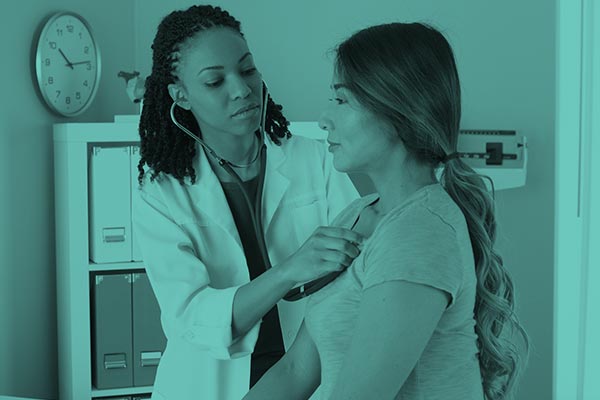 Doctor detecting heartbeat clinical card