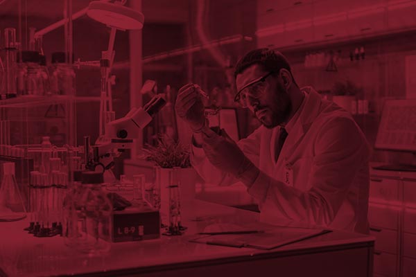 scientist using eye dropper